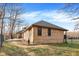 Exterior view of brick house with fenced-in yard and trees beyond at 7023 Mustang Ct, Martinsville, IN 46151
