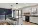 Eat-in kitchen with granite countertops, stainless appliances, and adjacent railing at 7023 Mustang Ct, Martinsville, IN 46151
