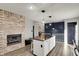 Open kitchen with granite countertop island, stainless appliances, and fireplace at 7023 Mustang Ct, Martinsville, IN 46151