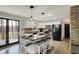 Bright eat-in kitchen features an island with stool seating, stainless appliances, and door to outdoor deck at 7023 Mustang Ct, Martinsville, IN 46151