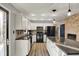 This bright eat-in kitchen boasts granite countertops, stainless appliances, and brick fireplace at 7023 Mustang Ct, Martinsville, IN 46151