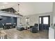 Open-concept living room featuring vaulted ceilings, gray walls, and modern furnishings at 7023 Mustang Ct, Martinsville, IN 46151