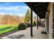 Covered patio with a view of the lush lawn and trees at 7023 Mustang Ct, Martinsville, IN 46151