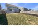 Spacious backyard with a well-maintained lawn and a wooden fence, providing privacy and room for outdoor activities at 733 Keepsake Run, Greenwood, IN 46143