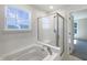 Bright bathroom with shower and soaking tub at 733 Keepsake Run, Greenwood, IN 46143