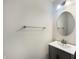 Neutral powder room with a single sink vanity and round mirror at 733 Keepsake Run, Greenwood, IN 46143
