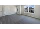 Spacious bedroom features two windows and neutral-colored carpet at 733 Keepsake Run, Greenwood, IN 46143