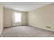 Spacious bedroom featuring neutral carpeting and a window offering plenty of natural light at 7607 Farm View E Cir, Indianapolis, IN 46256