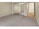 Spacious bedroom with carpet and a mirrored closet offers generous storage space at 7607 Farm View E Cir, Indianapolis, IN 46256