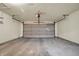 Attached garage featuring a concrete floor, a roll-up door, and an automatic garage door opener at 7607 Farm View E Cir, Indianapolis, IN 46256