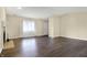 Bright living room with modern flooring and a cozy fireplace for relaxing at 7607 Farm View E Cir, Indianapolis, IN 46256