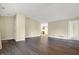 Open-concept living area with laminate flooring and lots of natural light at 7607 Farm View E Cir, Indianapolis, IN 46256