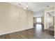 Spacious living room features natural light and neutral walls with gray flooring at 7607 Farm View E Cir, Indianapolis, IN 46256