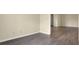 Bright living room boasts laminate flooring and neutral paint, creating an open atmosphere at 7607 Farm View E Cir, Indianapolis, IN 46256