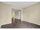 Spacious living room with neutral walls, gray flooring, and an open view to the foyer at 7607 Farm View E Cir, Indianapolis, IN 46256