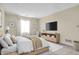 Serene main bedroom with natural light, a comfortable bed, and a sleek entertainment center at 7607 Farm View E Cir, Indianapolis, IN 46256