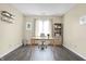 A quiet home office features a desk, chair, and plenty of natural light at 7607 Farm View E Cir, Indianapolis, IN 46256