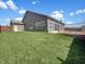Large, well-maintained backyard featuring artificial turf and a wooden deck at 943 Foxglove St, Lebanon, IN 46052
