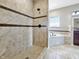Well-lit bathroom with tiled walk-in shower and soaking tub featuring modern fixtures and finishes at 943 Foxglove St, Lebanon, IN 46052