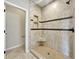 Bathroom showing a tiled walk-in shower featuring tiled insets, corner seat, and toiletry shelf at 943 Foxglove St, Lebanon, IN 46052