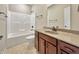 Bathroom featuring a vanity with a sink, mirror and a bathtub with shower head at 943 Foxglove St, Lebanon, IN 46052