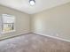 Clean bedroom with neutral color, window, carpet, and natural light at 943 Foxglove St, Lebanon, IN 46052