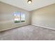 Bedroom with neutral carpet and paint complemented by a bright window view at 943 Foxglove St, Lebanon, IN 46052