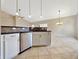 Kitchen bar with stainless steel dishwasher and tiled backsplash at 943 Foxglove St, Lebanon, IN 46052