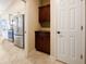 Kitchen area featuring stainless steel appliances and adjacent pantry cabinets at 943 Foxglove St, Lebanon, IN 46052