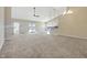 A spacious, open-concept living room with vaulted ceilings and a walk-out deck at 943 Foxglove St, Lebanon, IN 46052