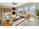 Bright living room features a fireplace, built-in shelving, and lots of natural light at 943 Foxglove St, Lebanon, IN 46052