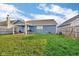 Spacious backyard featuring a covered patio, fenced perimeter, and a lush lawn at 972 Redwood Dr, Franklin, IN 46131