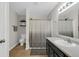 A clean bathroom offers a single vanity, shower with curtain, and tile floors at 972 Redwood Dr, Franklin, IN 46131