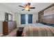 Cozy bedroom with wood accent wall, a comfortable bed, and a stylish dresser at 972 Redwood Dr, Franklin, IN 46131
