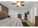This bedroom features a wood accent wall, ceiling fan, and neutral color palette at 972 Redwood Dr, Franklin, IN 46131