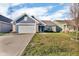 Charming single-story home with a well-manicured lawn and attached two-car garage at 972 Redwood Dr, Franklin, IN 46131