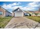 Lovely exterior view showcasing the home's brick and siding details and the spacious driveway at 972 Redwood Dr, Franklin, IN 46131