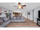 Open concept living room featuring hardwood floors, modern furnishings, and a seamless flow to the kitchen at 972 Redwood Dr, Franklin, IN 46131