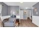 Living room includes seating, wood-look floors, and neutral gray walls at 972 Redwood Dr, Franklin, IN 46131