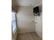 Bedroom equipped with a wall-mounted TV and shelf, illuminated by natural light at 10072 Graceful Landing Dr, Indianapolis, IN 46234