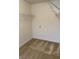 Walk-in closet with carpet flooring and wire shelving for organized storage at 10072 Graceful Landing Dr, Indianapolis, IN 46234