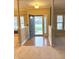 Inviting foyer with hardwood floors and an open entryway, offering a welcoming entrance into the home at 10072 Graceful Landing Dr, Indianapolis, IN 46234