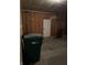 Garage interior featuring concrete floor, exposed wooden framing and a door at 10072 Graceful Landing Dr, Indianapolis, IN 46234