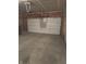 Spacious garage with concrete floor and an automatic door opener at 10072 Graceful Landing Dr, Indianapolis, IN 46234