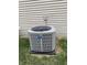 Close-up of an outdoor American Standard air conditioning unit on a green, grassy lawn at 10072 Graceful Landing Dr, Indianapolis, IN 46234