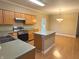 Well-lit kitchen with stainless steel appliances, an island, and ample counter space, perfect for cooking and gathering at 10072 Graceful Landing Dr, Indianapolis, IN 46234