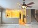 Open floor plan with hardwood floors, a view of the kitchen, and staircase to the second level at 10072 Graceful Landing Dr, Indianapolis, IN 46234