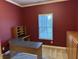 Office with corner desk, window views, and built-in wooden cabinets at 10072 Graceful Landing Dr, Indianapolis, IN 46234