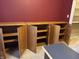 Wooden cabinets with storage shelves and open doors in an office space at 10072 Graceful Landing Dr, Indianapolis, IN 46234