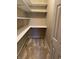 Walk-in pantry with built-in shelves and carpeted flooring at 10072 Graceful Landing Dr, Indianapolis, IN 46234